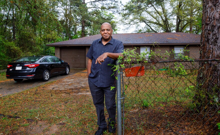 Gregory Curry stands in the front of the house he is now renting after a seven-month stretch of being without a home, Sunday in Dothan, Ala. Last year COVID-19 shut down the furniture store where he worked as a salesman and started his journey through economic uncertainty and eviction.