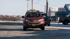 A Kusko Cab driver waits for passengers outside of the Ravn Air terminal in Bethel, Alaska on March 16, 2020.
