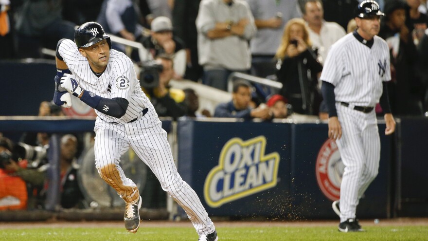 Jeter heads for home on a hit by catcher Brian McCann in the first inning against the Orioles.