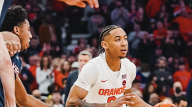 Syracuse guard Judah Mintz attempts to work around No.6 Virginia’s defense Monday night. The freshman had 20 points on 8-13 shooting.