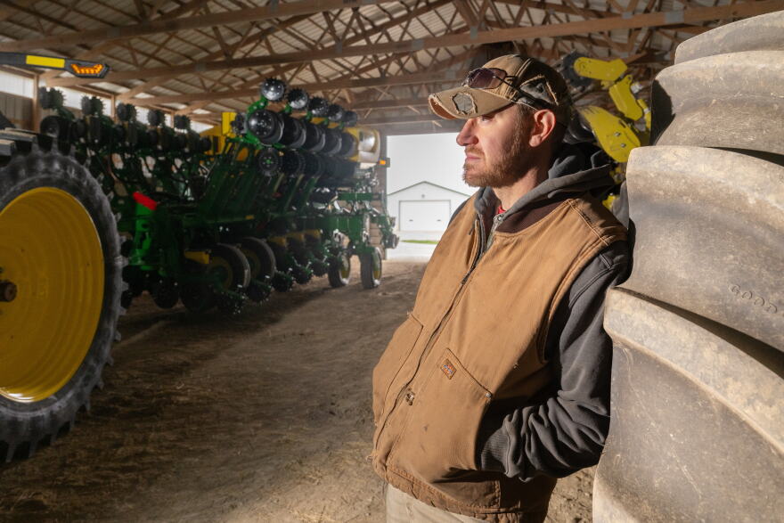Jake Lieb with his John Deere equipment on Monday, March 18, 2024, at his farm near Monticello, Ill.