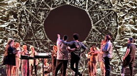 Director Sam Brukhman (center) with composer Sahba Aminikia and the digital artwork of Kevork Mourad onstage rehearsing "Shams" at the Moody Performance Hall