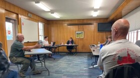 Grant Darrow, left, speaks to the Union County Board of Commissioners in this October 2022 file photo, as Mike McCarter, right, listens at Union County offices in La Grande, Ore.