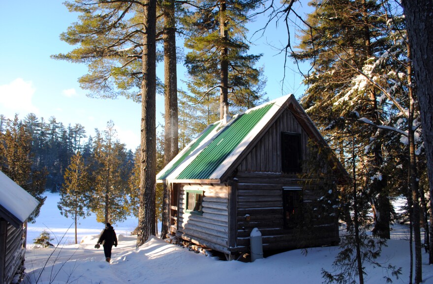 This Dec. 2012 photo shows a rustic cabin in the snow near Greenville, Maine.