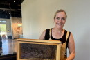 Author Shanna Upchurch shows off some of her bees as part of her appearance at Brittany's Favorite Things in Melissa.