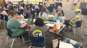 The Wichita teachers union conducted a sit-in demonstration at the Wichita Board of Education meeting on Monday, inviting teachers to bring work they usually do at home to complete during the meeting.