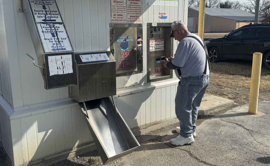 Leroy Davidson pays for his water at a kiosk in Pittsburg, Kansas, on Feb. 10, 2026. It was not among those tested in the University of Iowa research. He said he gets water from the kiosk about twice a month.