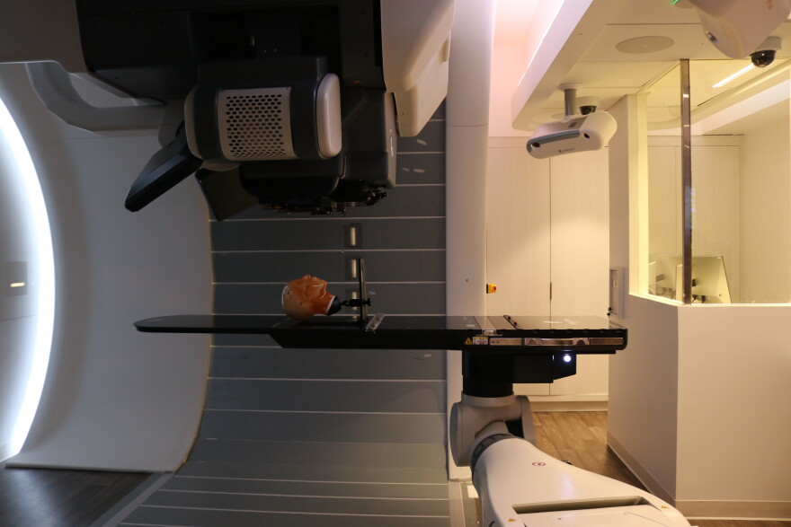 A human head model sits on the table of The Connecticut Proton Center's proton therapy machine.
