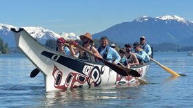 Pullers on Petersburg’s killer whale canoe paddle in the water at Auke Recreation Area near Juneau on June 2, 2026.