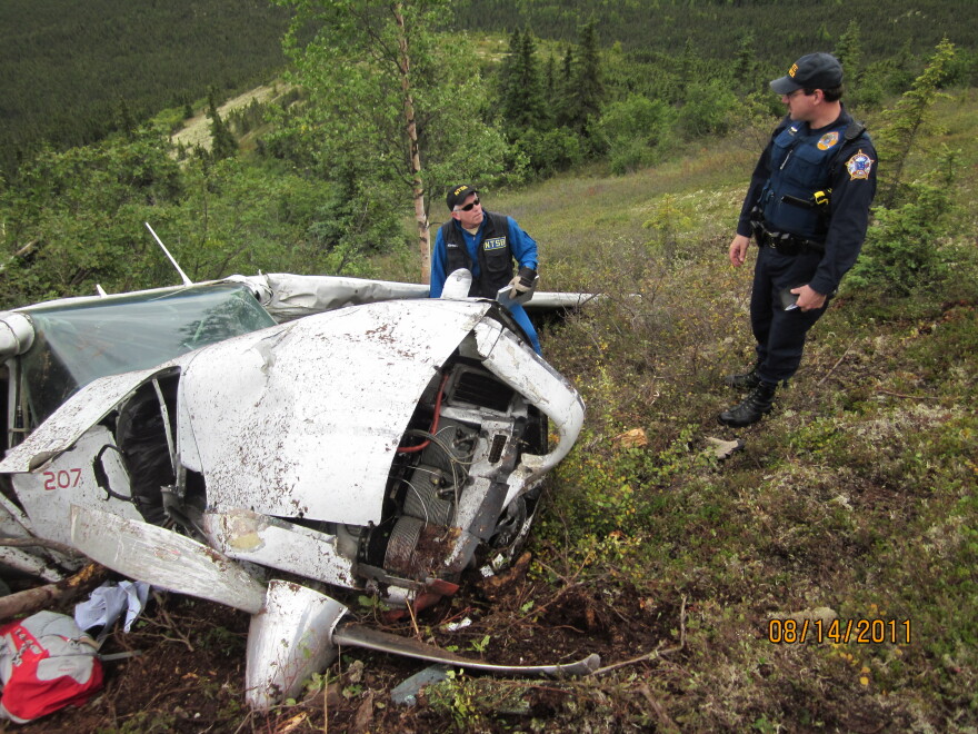 Clint Johnson (left) and David Russell at the site of a Cessna 207 accident
