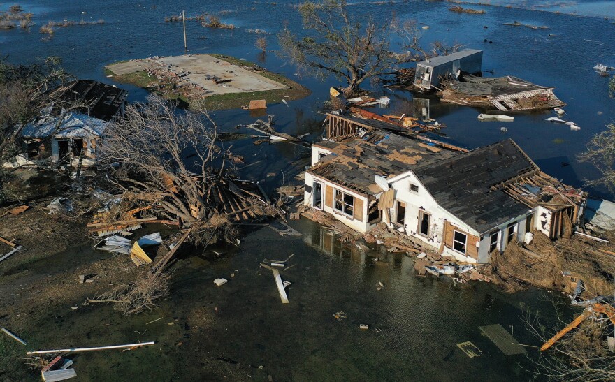 An aerial view of flood waters from Hurricane Delta surrounding structures destroyed by Hurricane Laura on Oct. 10, 2020 in Creole, Louisiana. Hurricane Delta made landfall near Creole as a Category 2 storm in Louisiana initially leaving some 300,000 customers without power.  (Mario Tama/Getty Images)