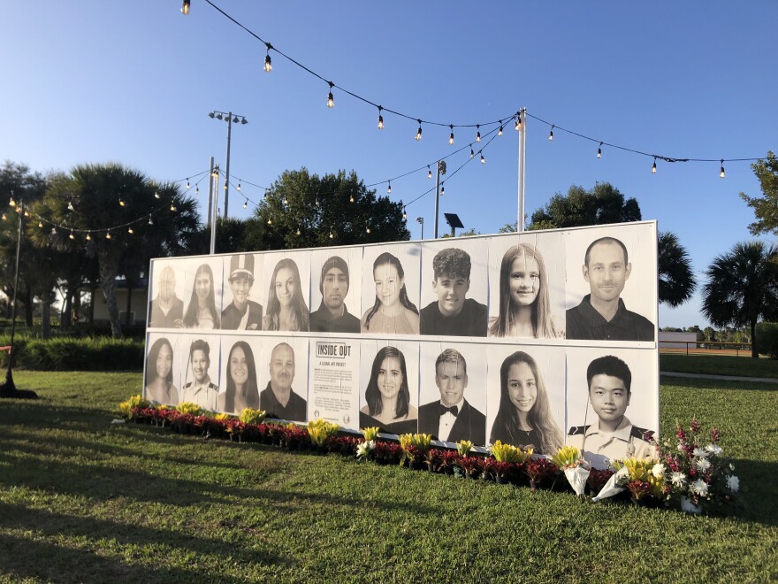 A wall of photos of the 17 people killed was lined with flowers at the Parkland memorial event last month in Pine Trails Park. 