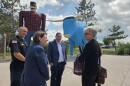 U.S. Sen. Amy Klobuchar, front left, visits with a staffer in front of Paul Bunyan and Babe the Blue Ox with Bemidji Fire Chief Justin Sherwood, back left, and Mayor Jorge Prince, center, on July 25, 2025.