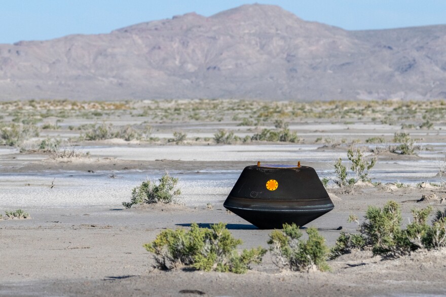 The sample return capsule from NASA’s OSIRIS-REx mission is seen shortly after touching down in the desert, Sunday, Sept. 24, 2023, at the Department of Defense's Utah Test and Training Range. The sample was collected from the asteroid Bennu in October 2020 by NASA’s OSIRIS-REx spacecraft.