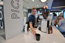 Kyle Mervau serves a cup of coffee at Electric City Roasting Co. inside Fidelity Bank in Dunmore.