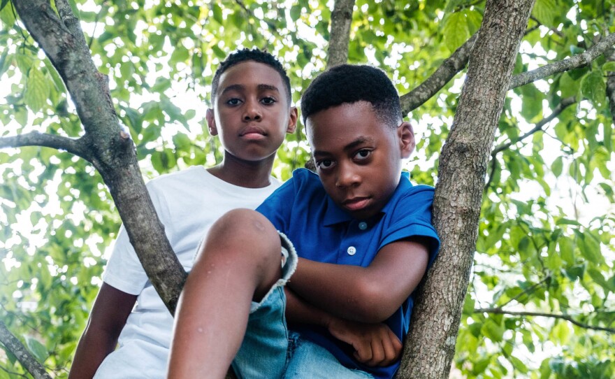 Rhea Roper Nedd says she and her husband teach their sons Christopher (left) and Noah to recognize the importance of changing narratives in society and recognizing that change is possible.