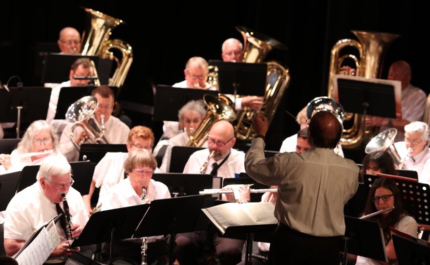 Abilene Community Band Director Joe Stephens conducts during "A Jubilant Overture" by Alfred Reed.