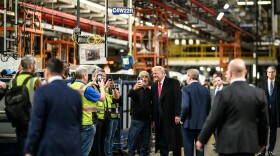 President Donald Trump talks with workers at Ford's F-150 factory in Dearborn.