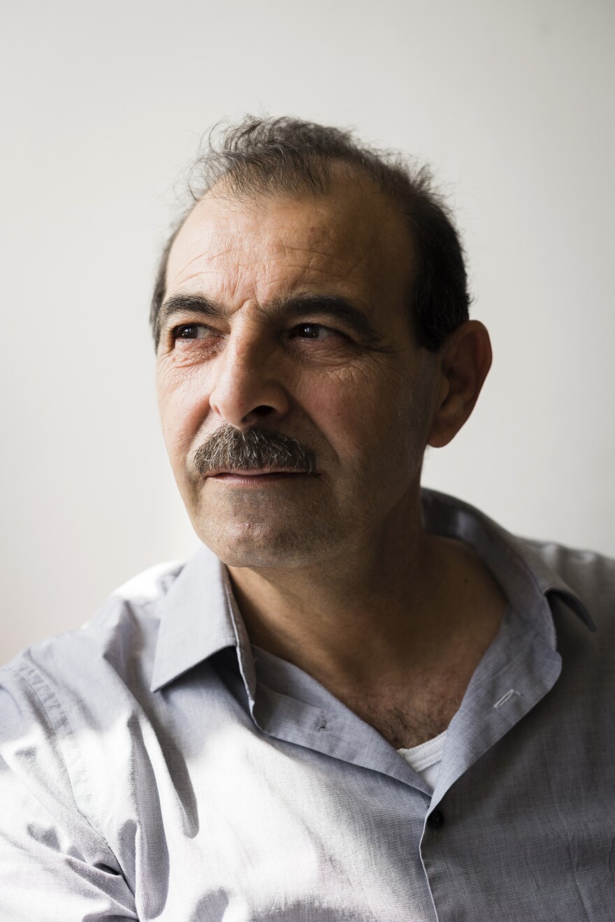 Syrian lawyer and human rights advocate Anwar al-Bunni has been living in Germany since 2014. Working with witnesses and other rights lawyers, he has been collecting evidence about Syrian war crimes. Above, he sits in his Berlin office.