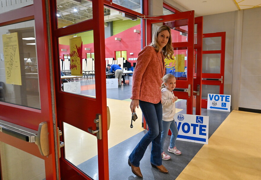 Scranton Mayor Paige Cognetti walks out of Isaac Tripp's polling area with her daughter, Sloane.