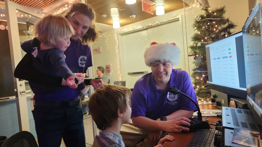 The Frissell family speaks to Santa at the school's amateur radio station.