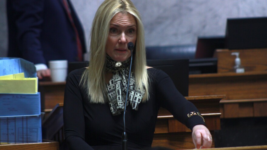 Sen. Shelli Yoder (D-Bloomington) speaking at the statehouse behind a podium