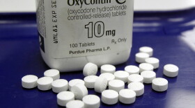 FILE - OxyContin pills arranged for a photo at a pharmacy, Feb. 19, 2013 in Montpelier, Vt. (AP Photo/Toby Talbot, File)