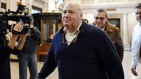 FILE - Michael Skakel enters the state Supreme Court for a hearing, in Hartford, CT, Feb. 24, 2016. Kennedy cousin Michael Skakel, whose murder conviction in the 1970s killing of a teenager in Connecticut was overturned, is suing the lead police investigator in the case and the town of Greenwich, Conn., for alleged malicious prosecution, civil rights violations and other claimed wrongdoing. (AP Photo/Jessica Hill, File)