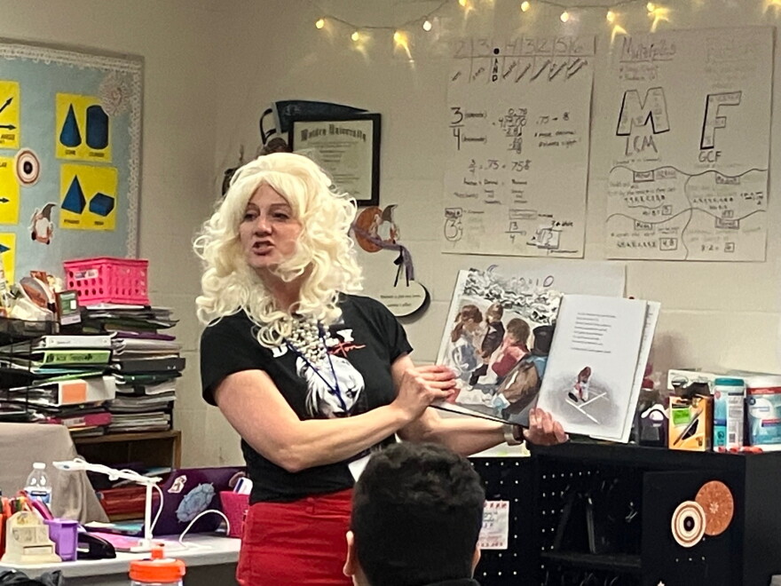 Dr. Beth Summers, Rock Island-Milan assistant superintendent for teaching and learning, dressed as Dolly Friday, Sept. 25, and read the book "Each Kindness" to the 6th-grade Longfellow class of Rebecca Zimmerman.