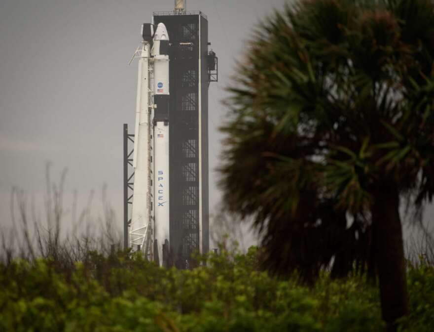 A SpaceX Falcon 9 rocket with the company's Crew Dragon spacecraft onboard is seen on the launch pad at Launch Complex 39A as preparations continue for the Demo-2 mission, Monday, May 25, 2020, at NASA’s Kennedy Space Center in Florida.  Photo Credit: (NASA/Bill Ingalls)