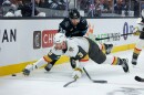 Vegas Golden Knights defenseman Brayden McNabb (3) goes down after the puck against Utah Mammoth defenseman Sean Durzi (50) during the third period of Game 6 in the first round of an NHL hockey Stanley Cup playoff series, Friday, May 1, 2026, in Salt Lake City. (AP Photo/Melissa Majchrzak)