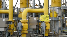 The lettering on a sign reads 'Uwaga gaz' (Attention gas) at the gas transmission point in Rembelszczyzna near Warsaw on April 27, 2022. (Janek Skarzynski/AFP via Getty Images)