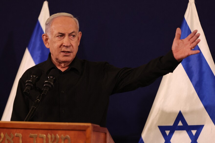 Israeli Prime Minister Benjamin Netanyahu speaks during a press conference in the Kirya military base in Tel Aviv on Saturday, amid ongoing battles between Israel and the Palestinian group Hamas.