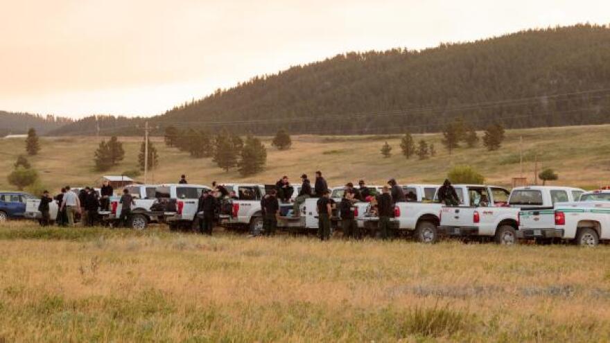 Some of the crews fighting the July fire on Friday morning