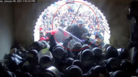 Wolcott resident Richard Markey attacks police officers with a wooden pole during the Jan. 6, 2021 Capitol insurrection