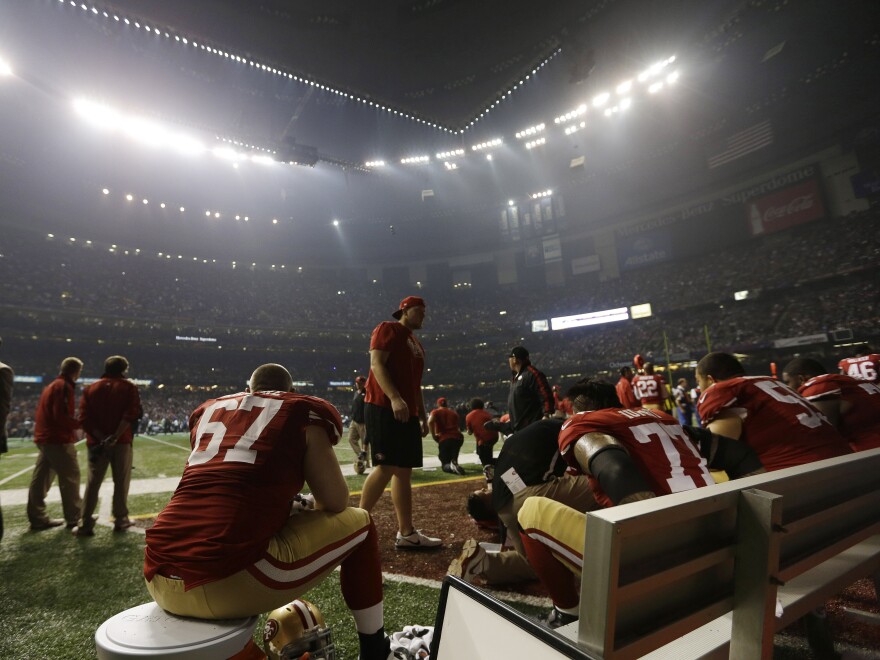 San Francisco 49ers offensive lineman Daniel Kilgore (67) waits on the bench during a power outage during the second half of the Super Bowl Sunday.