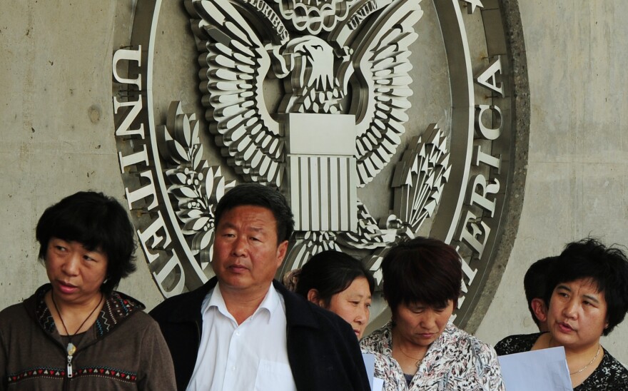 Chinese citizens wait to submit their visa applications at the U.S. Embassy in Beijing in 2012. Wait times for interviews once could stretch to a month or more.