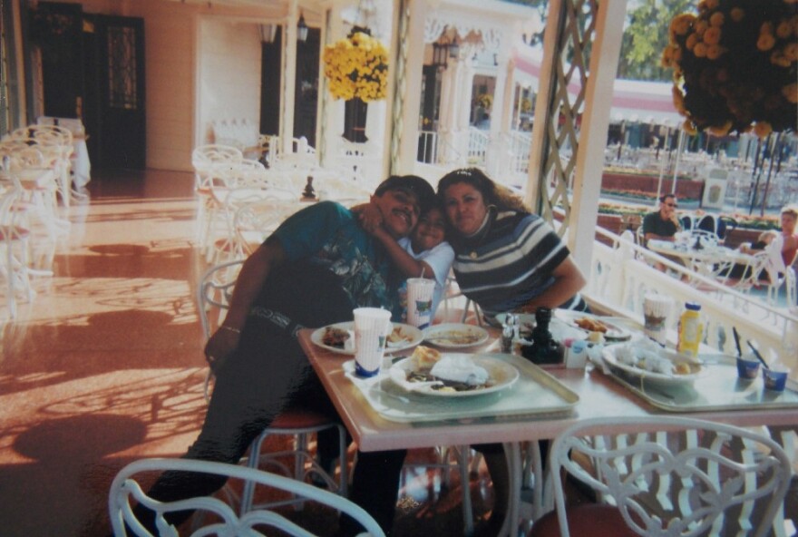 This family photo shows Hugo (left), Victor (middle), and Yolanda (right) as a family in the United States when Victor was young.