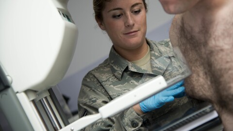 U.S. Air Force mammography technician Elisabeth Stone conducts a mammogram on a male patient at Joint Base Elmendorf-Richardson in Alaska in a 2014 file photo.