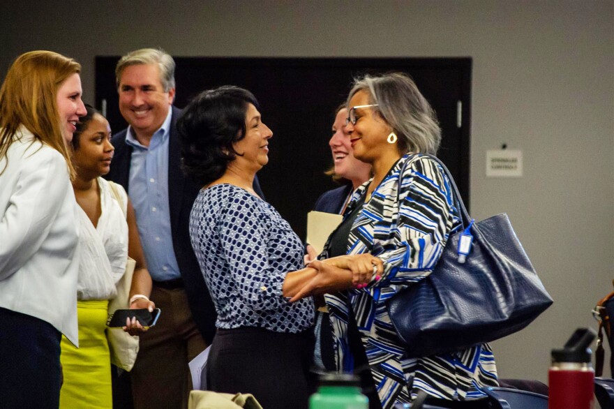 State Rep. Lisa Hernandez, who was elected chair of the Democratic Party of Illinois Saturday, is pictured with outgoing chair Robin Kelly, a congresswoman from Matteson. The pair embraced briefly before the meeting Saturday morning in which Hernandez was elected unanimously after a contentious effort by Hernandez's backers to replace Kelly in the days prior.
