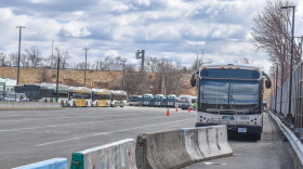 A fleet of Rhode Island Public Transit Authority buses is parked across the street from the agency’s Providence headquarters on Melrose Street.