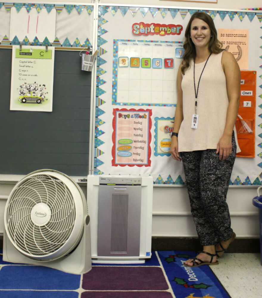 Frenchtown kindergarten teacher Justine Luebke shows off a brand new HEPA air filtration unit that will help purify the air in her classroom.