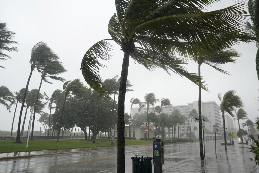 A normally bustling Ocean Drive is shown during a downpour, Sunday, Nov. 8, 2020, on Miami Beach. A strengthening Tropical Storm Eta cut across Cuba that Sunday before hitting the Florida Keys.