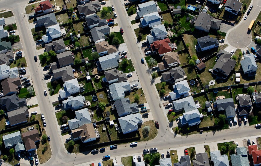 An aerial view of a new housing development near Fort McMurray, Alberta, Canada, in June. Economic activity has slowed in the area, but local residents are optimistic that the energy sector will rebound.