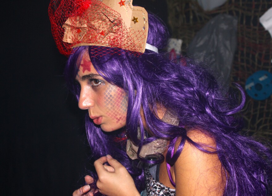 A mermaid lives in a trash heap after the ocean is polluted beyond saving. It was the opening scene in a haunted house designed by students in Delray Beach.