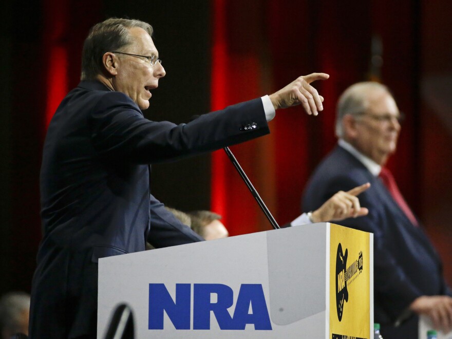 Wayne LaPierre, left, executive vice president of the National Rifle Association, speaks at the NRA convention in 2015. A Russian politician who claims to know President Trump through the group says he saw him at that convention.