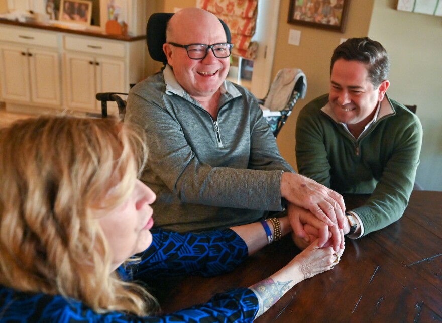 After Eileen Miller reached for Rep. Kyle Mullins, her husband Paul Miller joined in with a laugh. Eileen has been an advocate for ALS funding at a state level, Mullins is also in support of this as he helped his father in his battle. with the disease.
