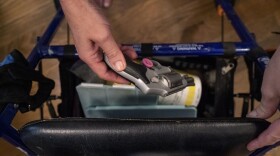 Janet Paulsen shows the gun she sometimes keeps in her walker at her home in Acworth, Ga., Monday, Aug. 7, 2023. “So I am not about willy-nilly taking guns away from people. But if you’re threatening to kill someone, yeah, you need to surrender that firearm.”