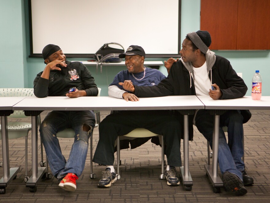 From left, Stephen Johnson, Harrelle Felipa and Cornelius Dixon attend a Responsible Fatherhood meeting at the Center for Urban Families on Nov. 11 in Baltimore. In exchange for participation in programs such as this, the state will reduce the men's child support debt.