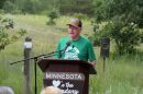 Gov. Tim Walz announces an executive order banning nonferrous mining near the Boundary Waters Canoe Area Wilderness at a news conference at the Belwin Conservancy near Afton State Park on Aug. 18, 2026.